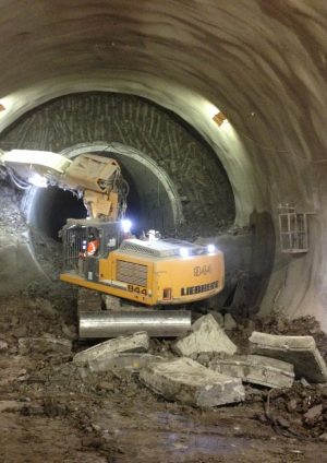 Figure 20: Excavation of top heading during enlargement of precast concrete pilot tunnel to full platform size (11m wide x 10m high).